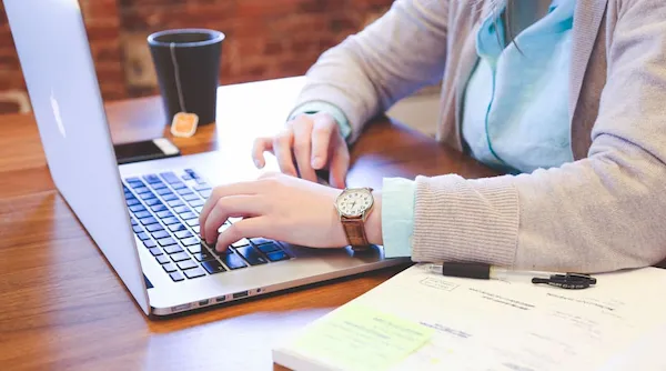 QuickBooks certified bookkeeper balancing the books for a small business client